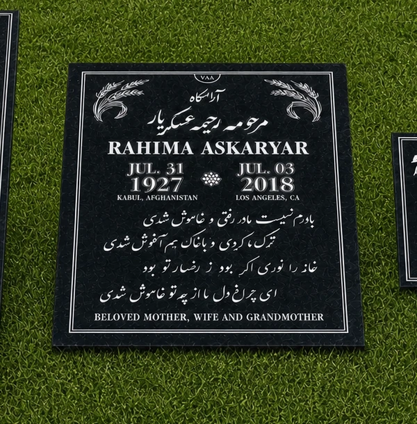 Half-ledger black granite flat marker on grass